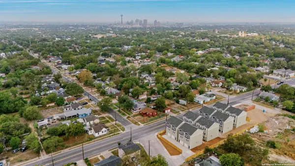 an aerial view of a city with lots of residential buildings