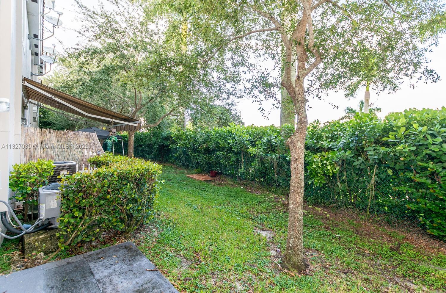 4979 Southwest 140th Terrace, Unit 8 Miramar, FL 33027 - Photo 11 of 43 a view of a house with a backyard