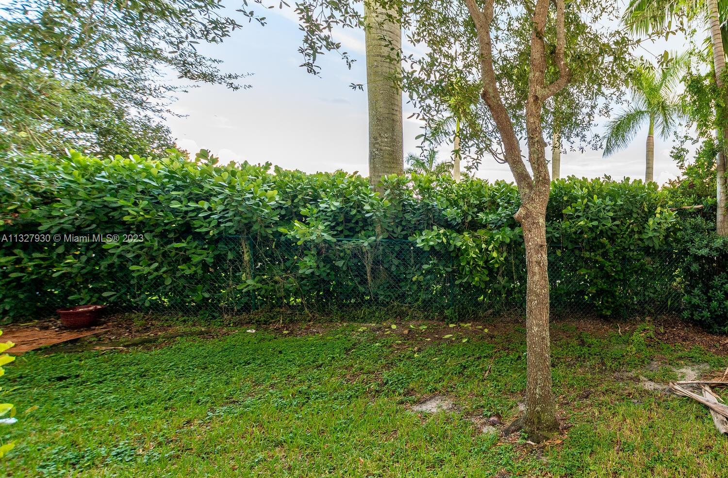 4979 Southwest 140th Terrace, Unit 8 Miramar, FL 33027 - Photo 12 of 43 a view of a yard