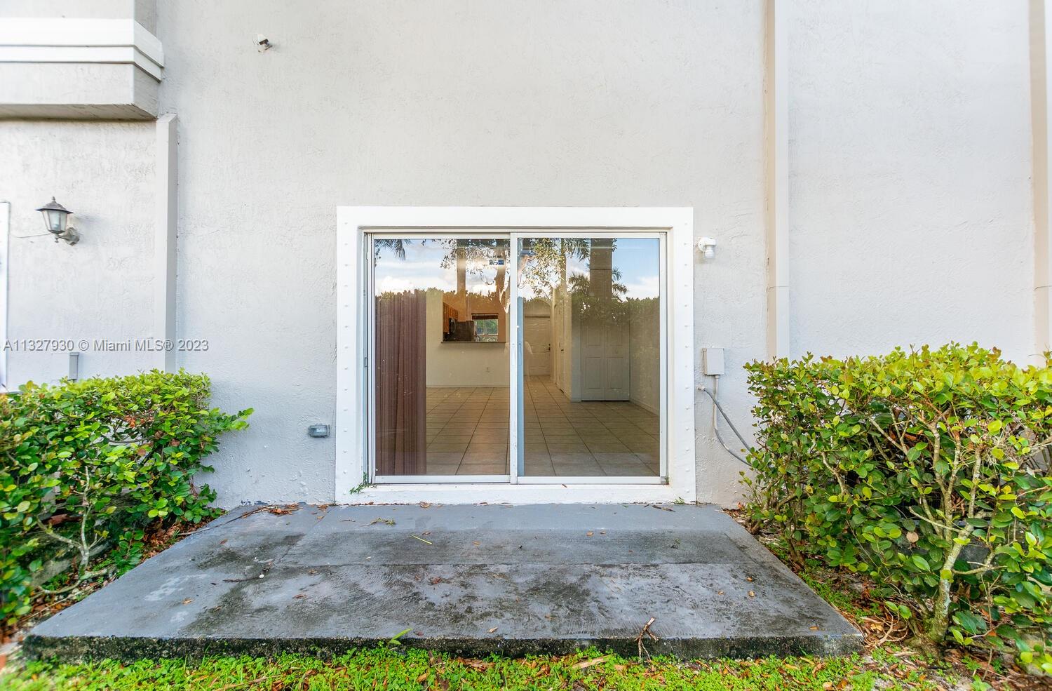 4979 Southwest 140th Terrace, Unit 8 Miramar, FL 33027 - Photo 14 of 43 a view of front door of house