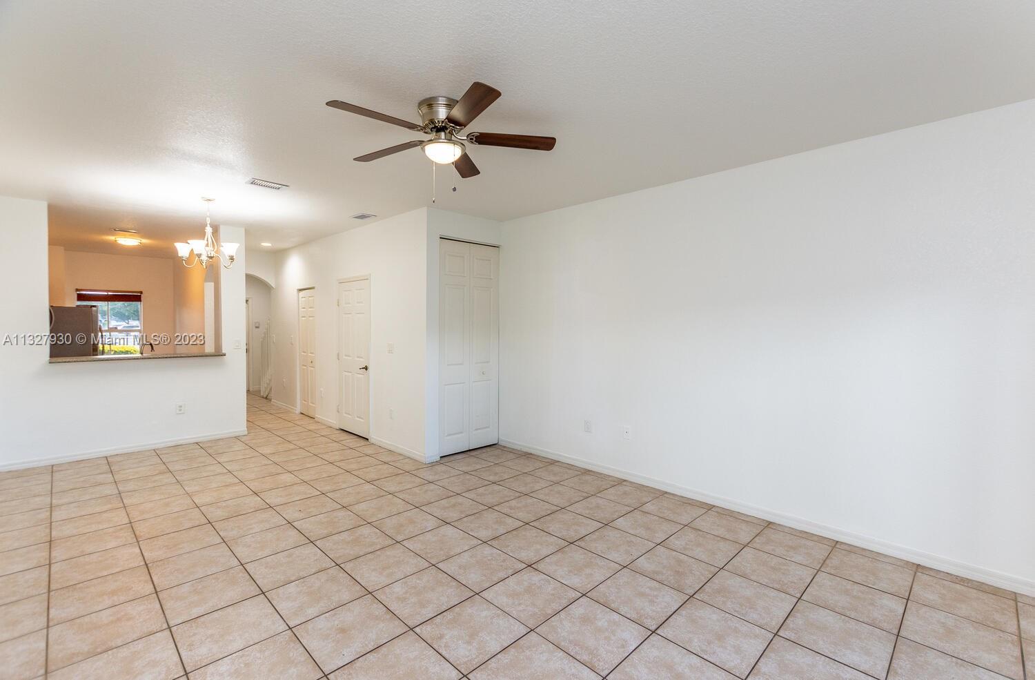 4979 Southwest 140th Terrace, Unit 8 Miramar, FL 33027 - Photo 15 of 43 a view of a livingroom and a chandelier fan