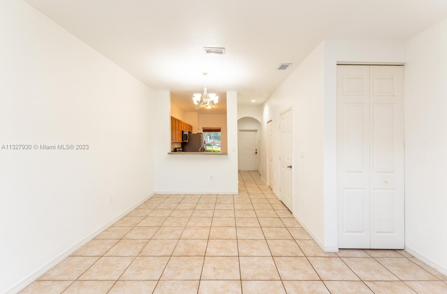 4979 Southwest 140th Terrace, Unit 8 Miramar, FL 33027 - Photo 17 of 43 a view of a hallway with wooden floor