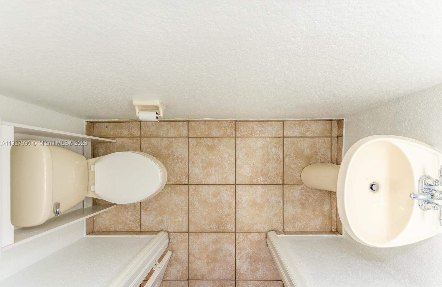 4979 Southwest 140th Terrace, Unit 8 Miramar, FL 33027 - Photo 18 of 43 a bathroom with a sink mirror and vanity