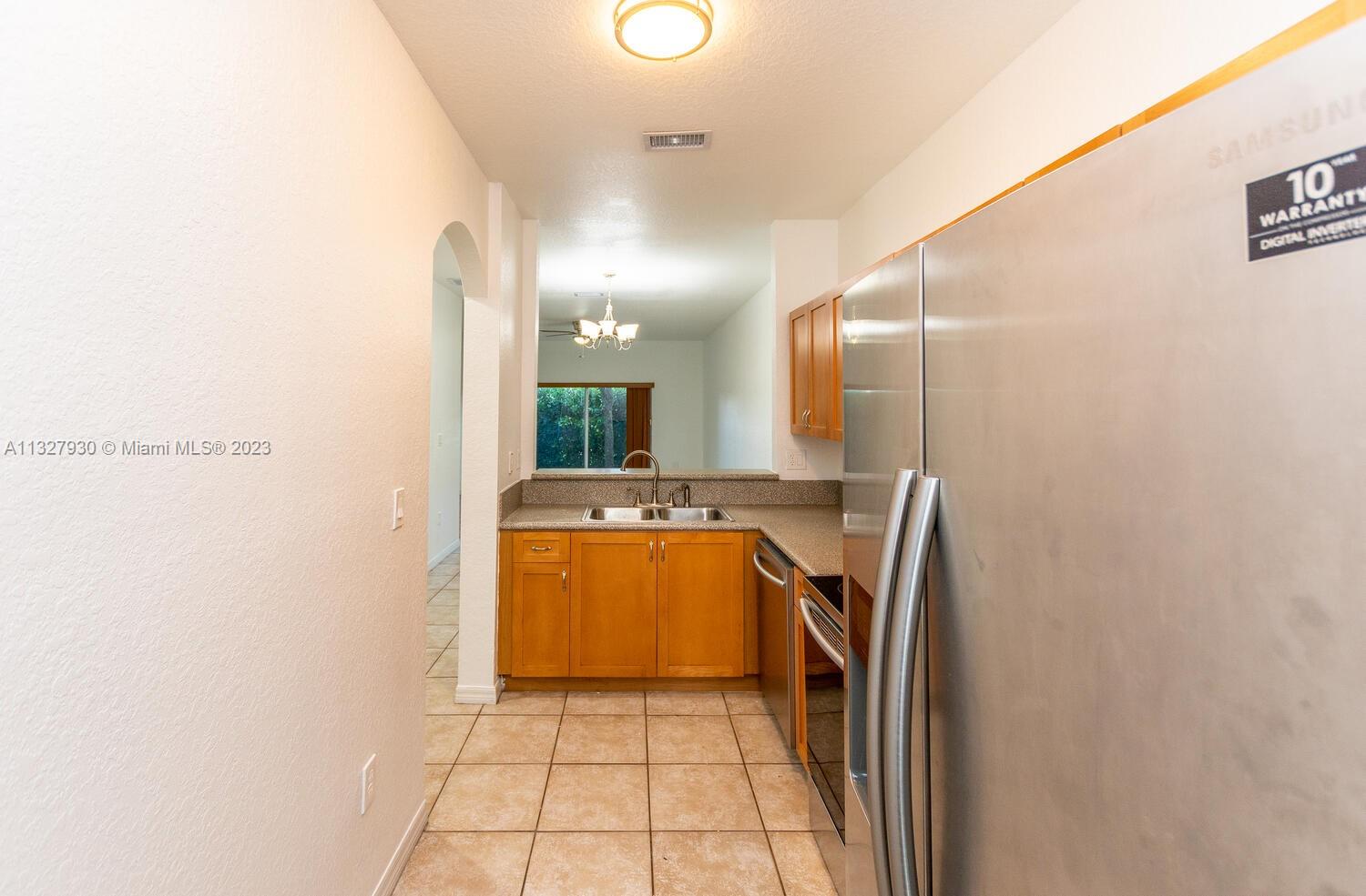 4979 Southwest 140th Terrace, Unit 8 Miramar, FL 33027 - Photo 21 of 43 a bathroom with a sink a toilet and shower