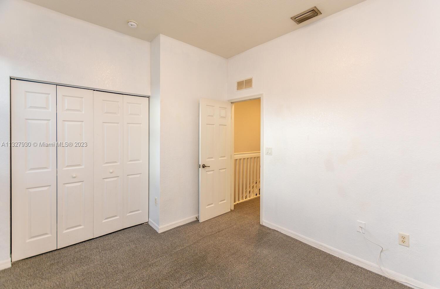 4979 Southwest 140th Terrace, Unit 8 Miramar, FL 33027 - Photo 30 of 43 a view of an empty room