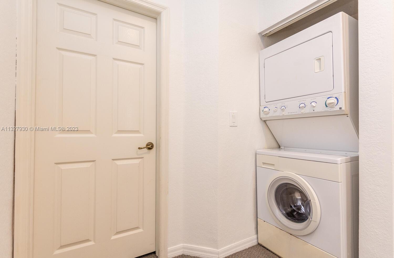 4979 Southwest 140th Terrace, Unit 8 Miramar, FL 33027 - Photo 33 of 43 a utility room with dryer and washer