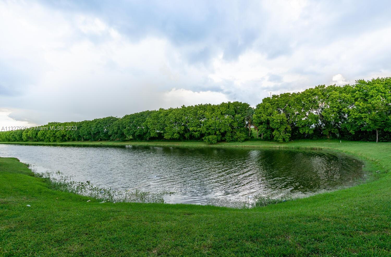 4979 Southwest 140th Terrace, Unit 8 Miramar, FL 33027 - Photo 40 of 43 a view of a lake