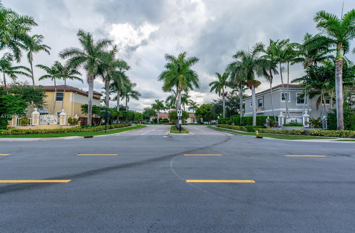 4979 Southwest 140th Terrace, Unit 8 Miramar, FL 33027 - Photo 41 of 43 a view of a street with a houses
