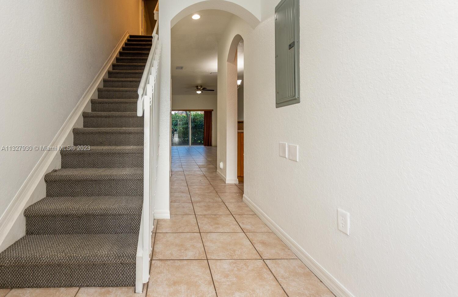 4979 Southwest 140th Terrace, Unit 8 Miramar, FL 33027 - Photo 6 of 43 a view of entryway and hall with wooden floor