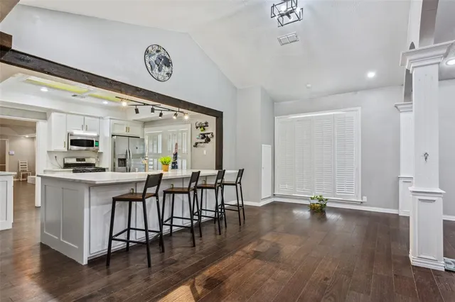 a view of a dining area with furniture and wooden floor