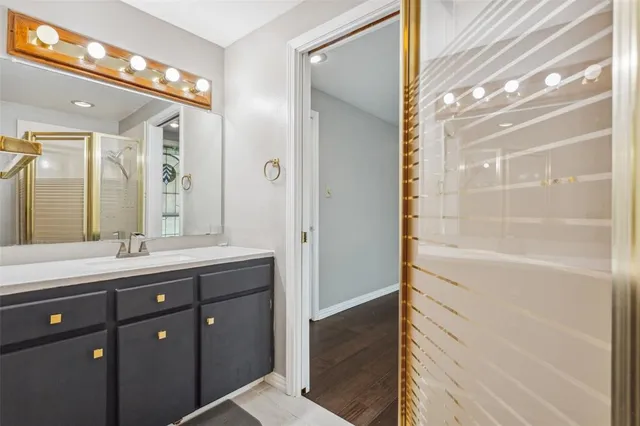 a bathroom with a double vanity sink and mirror