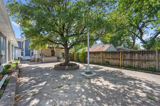 a house view with swimming pool and garden