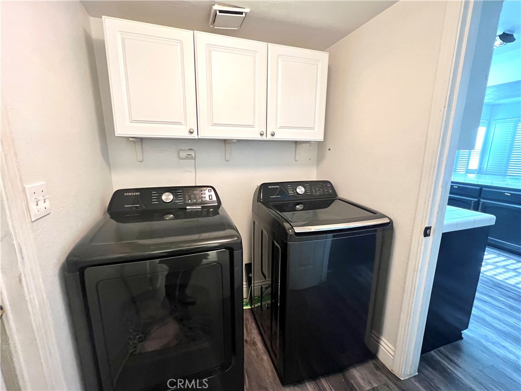 14016 Las Entradas Bakersfield, CA 93314 - Photo 14 of 25 a view of a storage and utility room with washer and dryer