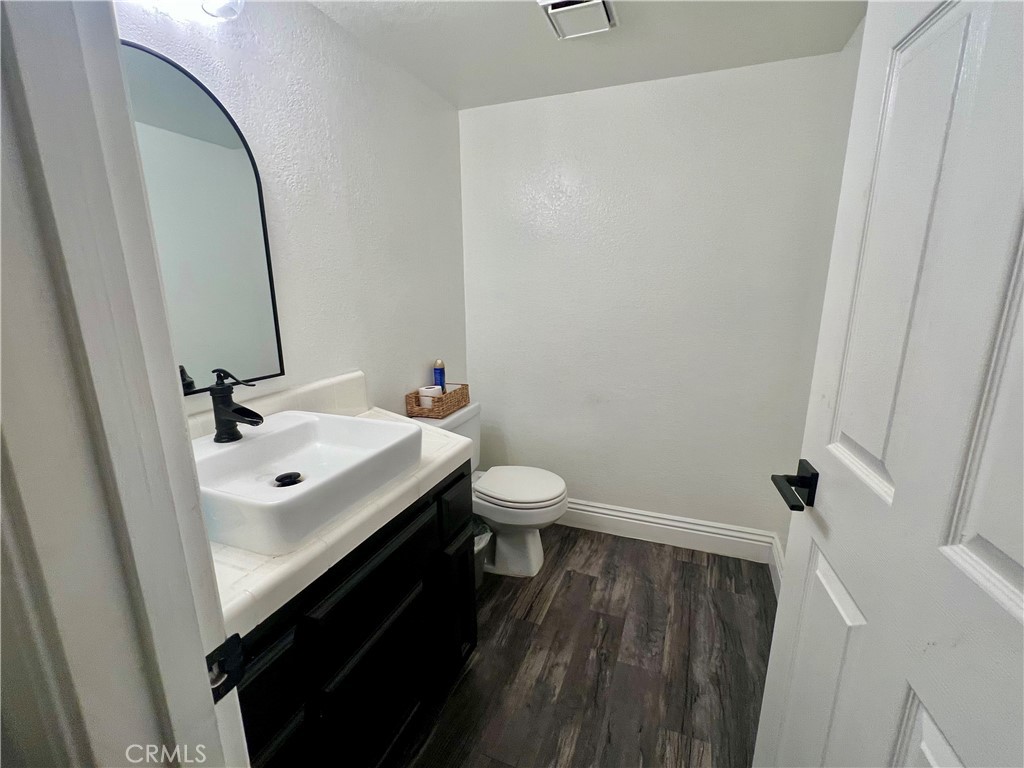 14016 Las Entradas Bakersfield, CA 93314 - Photo 16 of 25 a bathroom with a sink a toilet and a mirror