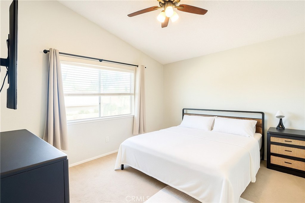 14016 Las Entradas Bakersfield, CA 93314 - Photo 17 of 25 a bedroom with a bed and a window