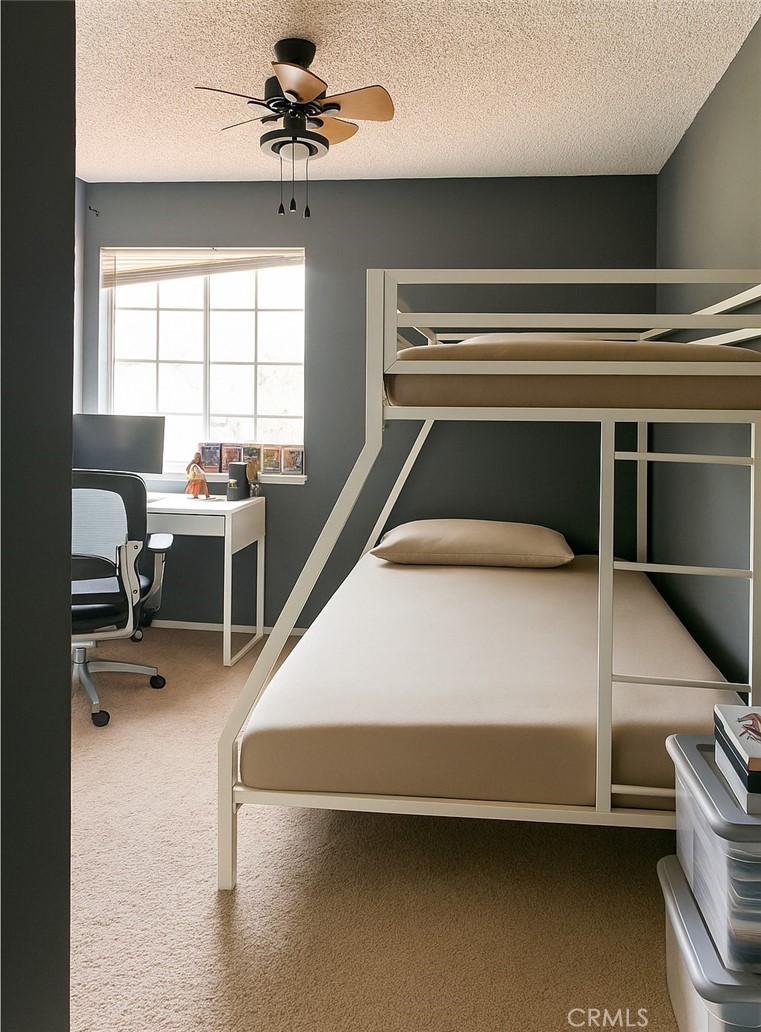 14016 Las Entradas Bakersfield, CA 93314 - Photo 25 of 25 a bedroom with a bed wooden floor and a window