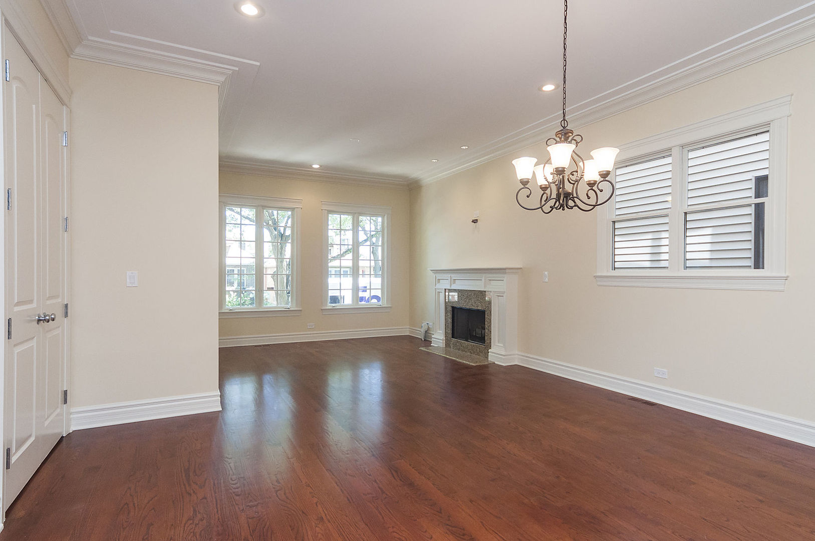 Undisclosed Address Chicago, IL 60618 - Photo 17 of 40 a view of an empty room with wooden floor and a window