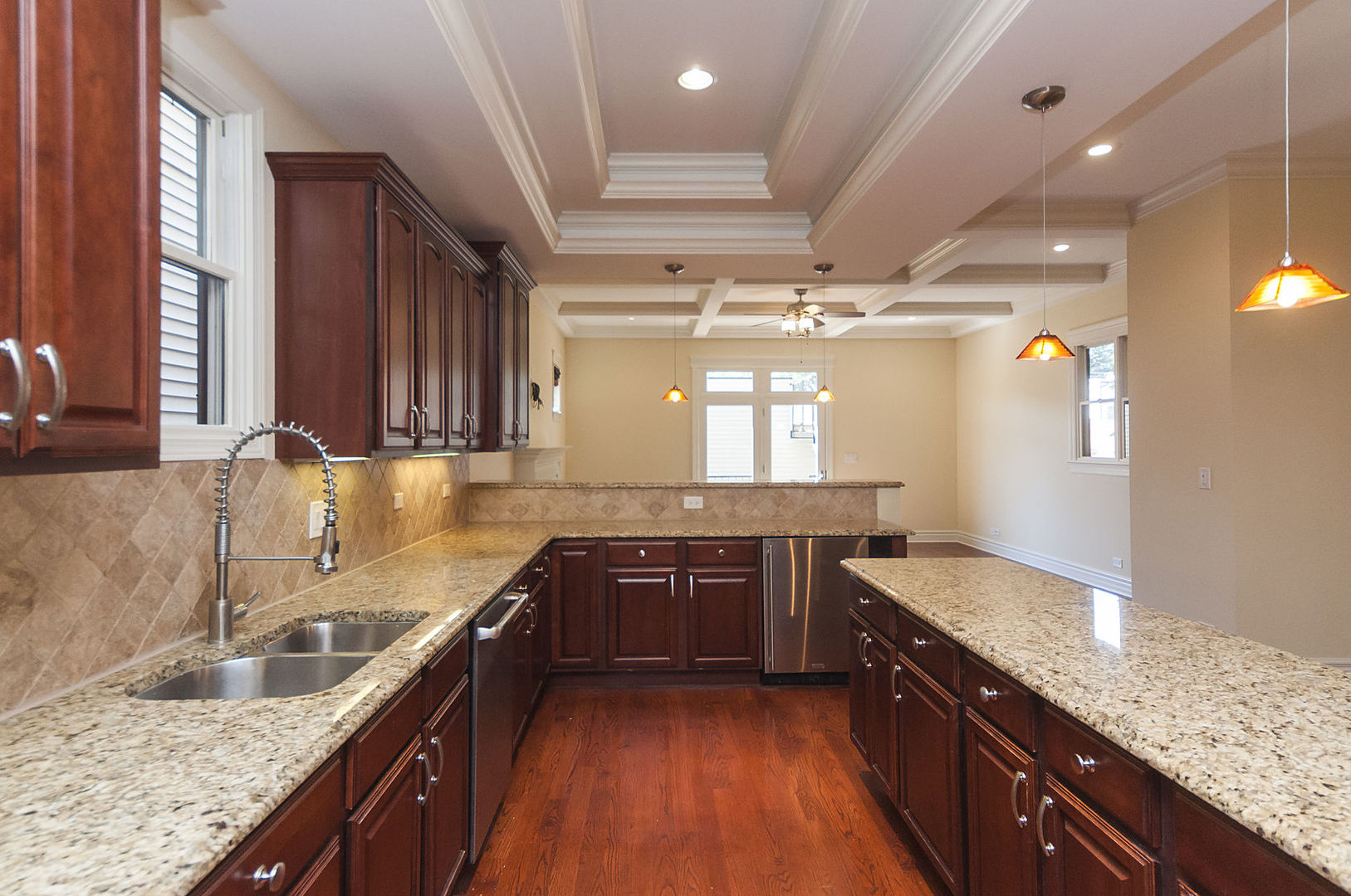 Undisclosed Address Chicago, IL 60618 - Photo 21 of 40 a large kitchen with a sink and cabinets