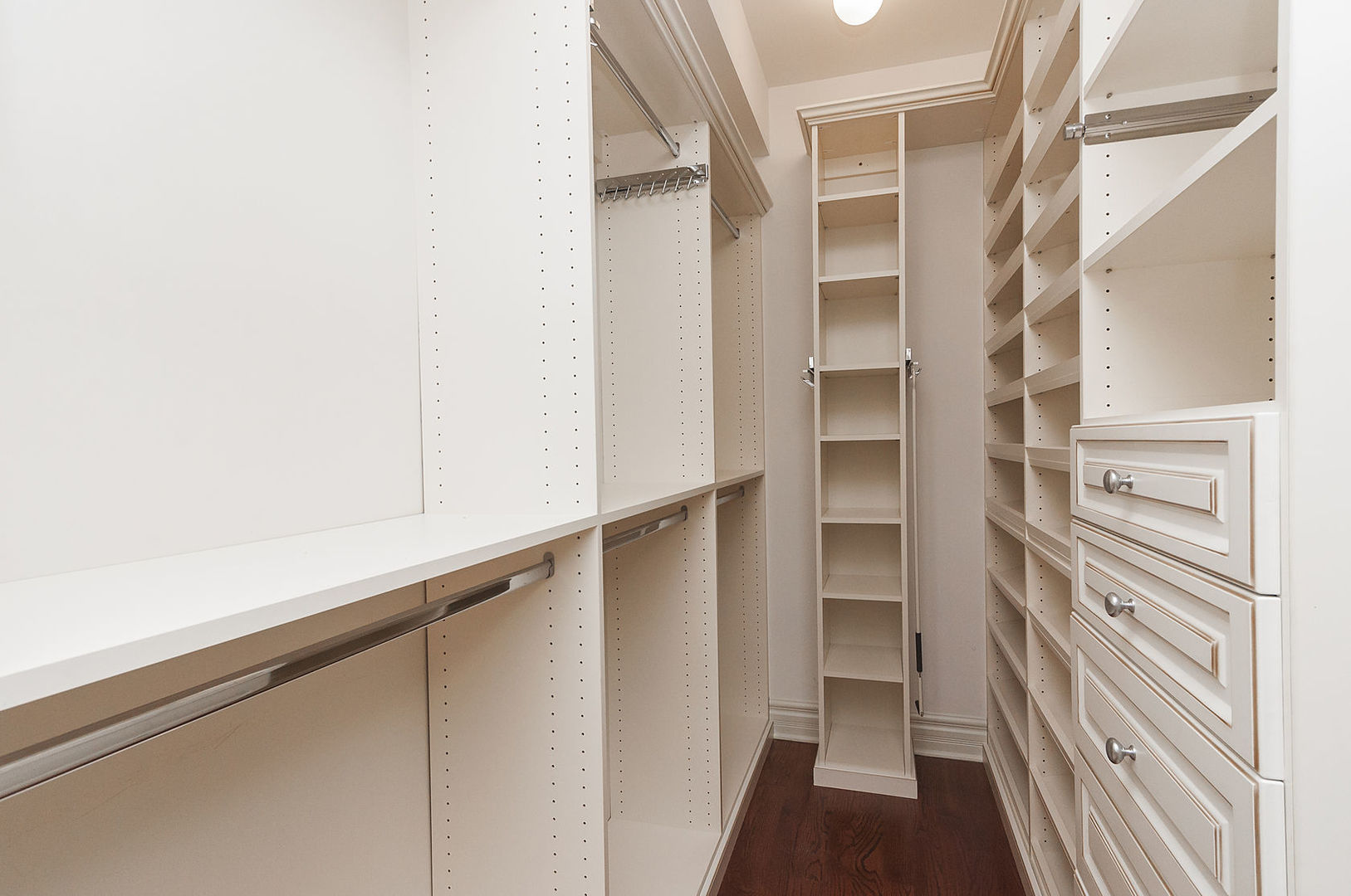 Undisclosed Address Chicago, IL 60618 - Photo 26 of 40 a view of walk in closet with empty racks