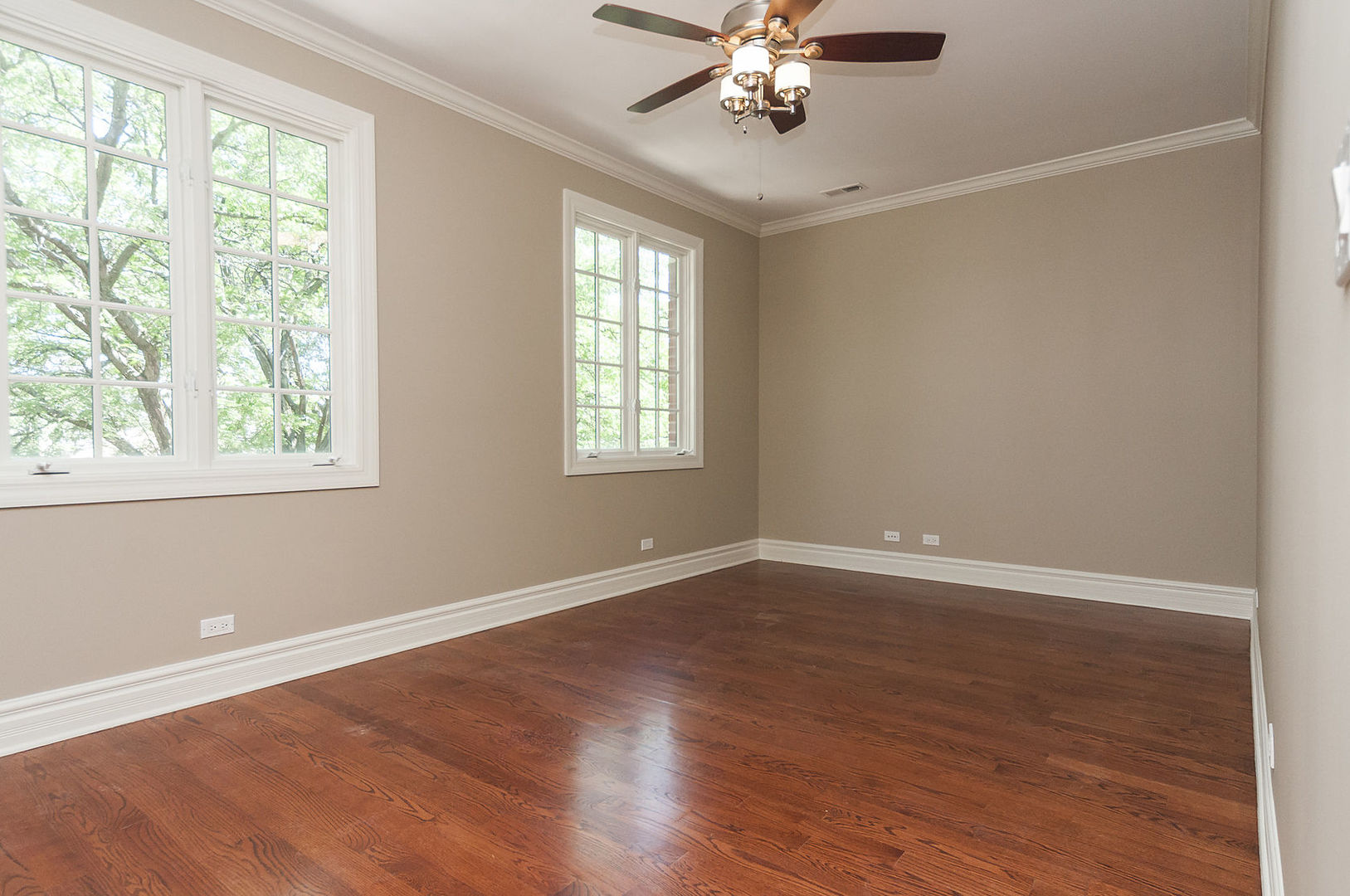 Undisclosed Address Chicago, IL 60618 - Photo 29 of 40 a view of an empty room with a window and wooden floor