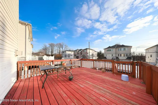 a view of a balcony with chairs