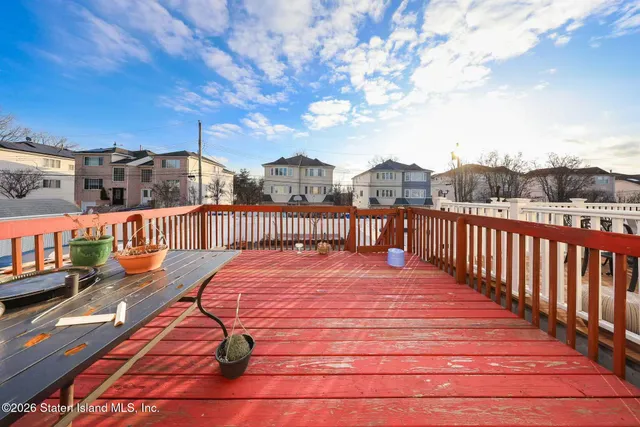 a balcony with trees in the background