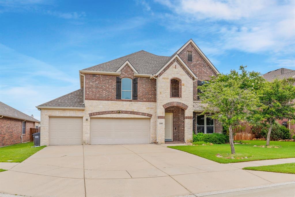 14700 Riverside Drive Little Elm, TX 75068 - Photo 1 of 1 a front view of a house with a yard and garage