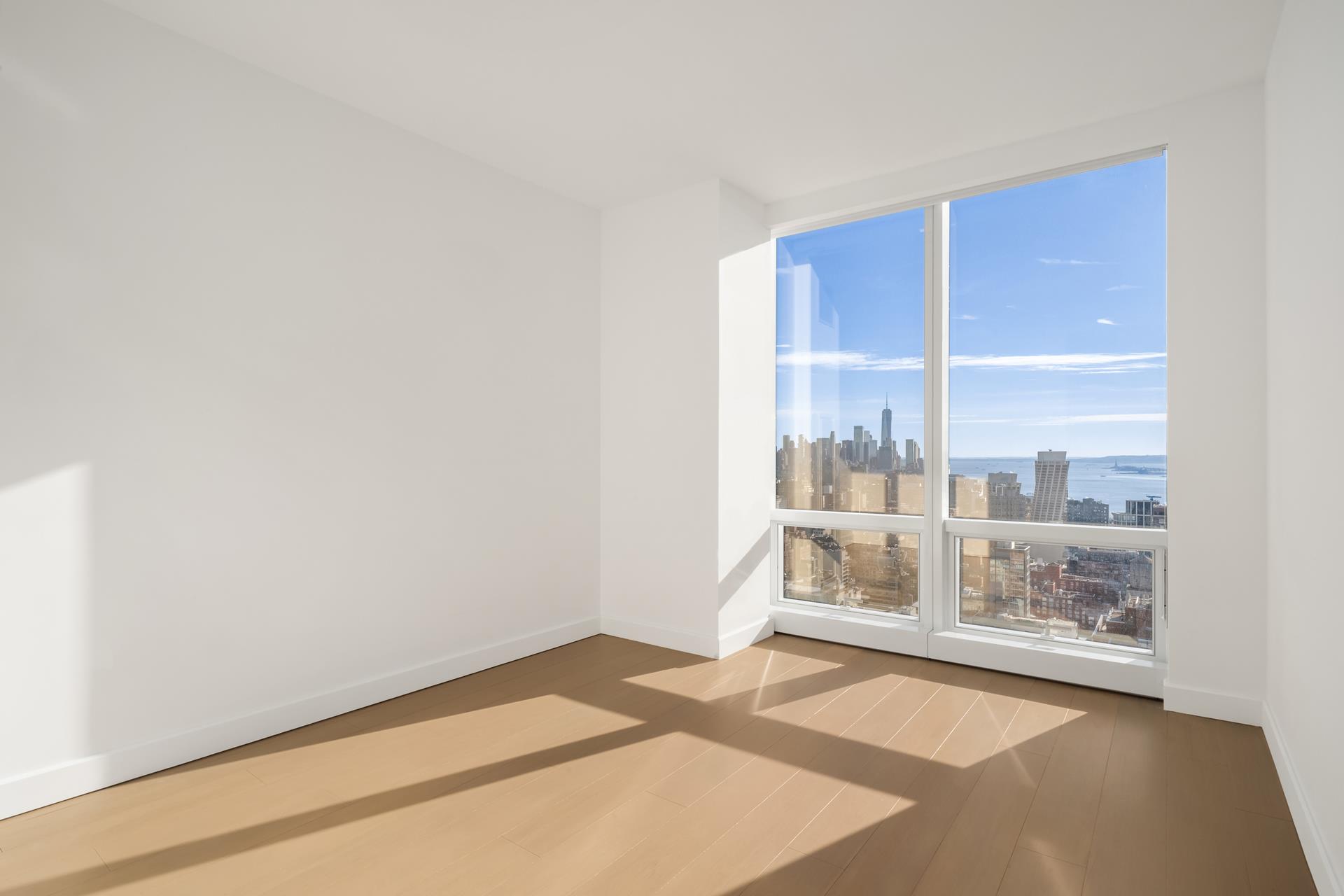 15 Hudson Yards, Unit 38C Manhattan, NY 10001 - Photo 13 of 31 a view of an empty room with a window