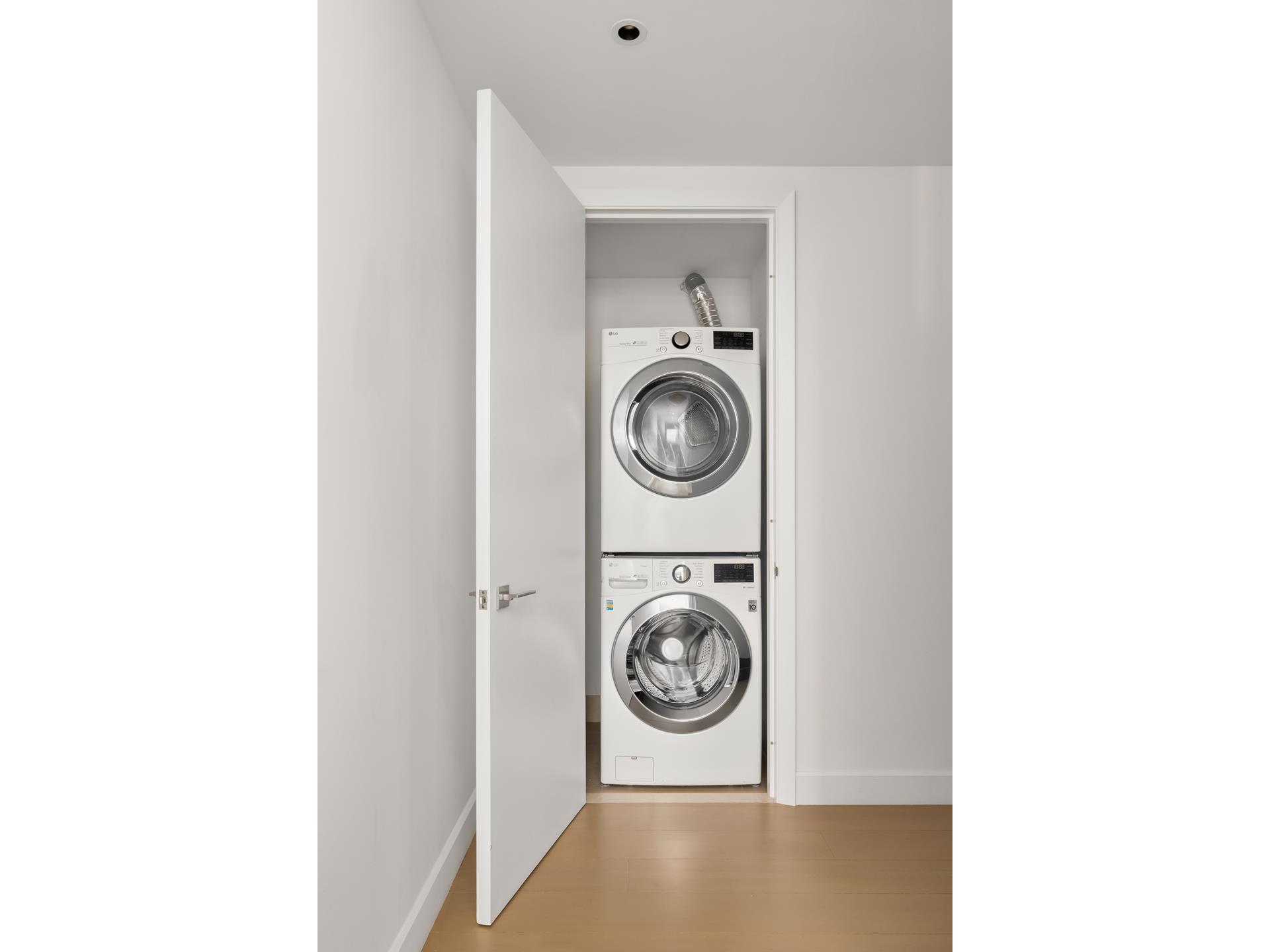 15 Hudson Yards, Unit 38C Manhattan, NY 10001 - Photo 16 of 31 a utility room with dryer and washer