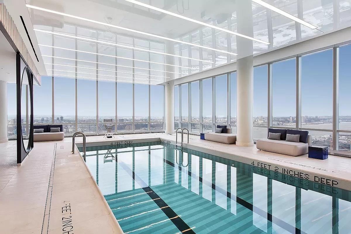 15 Hudson Yards, Unit 38C Manhattan, NY 10001 - Photo 17 of 31 a very nice looking room with lots of furniture and a large window