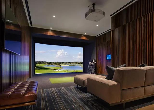 a room with furniture and painting on the wall