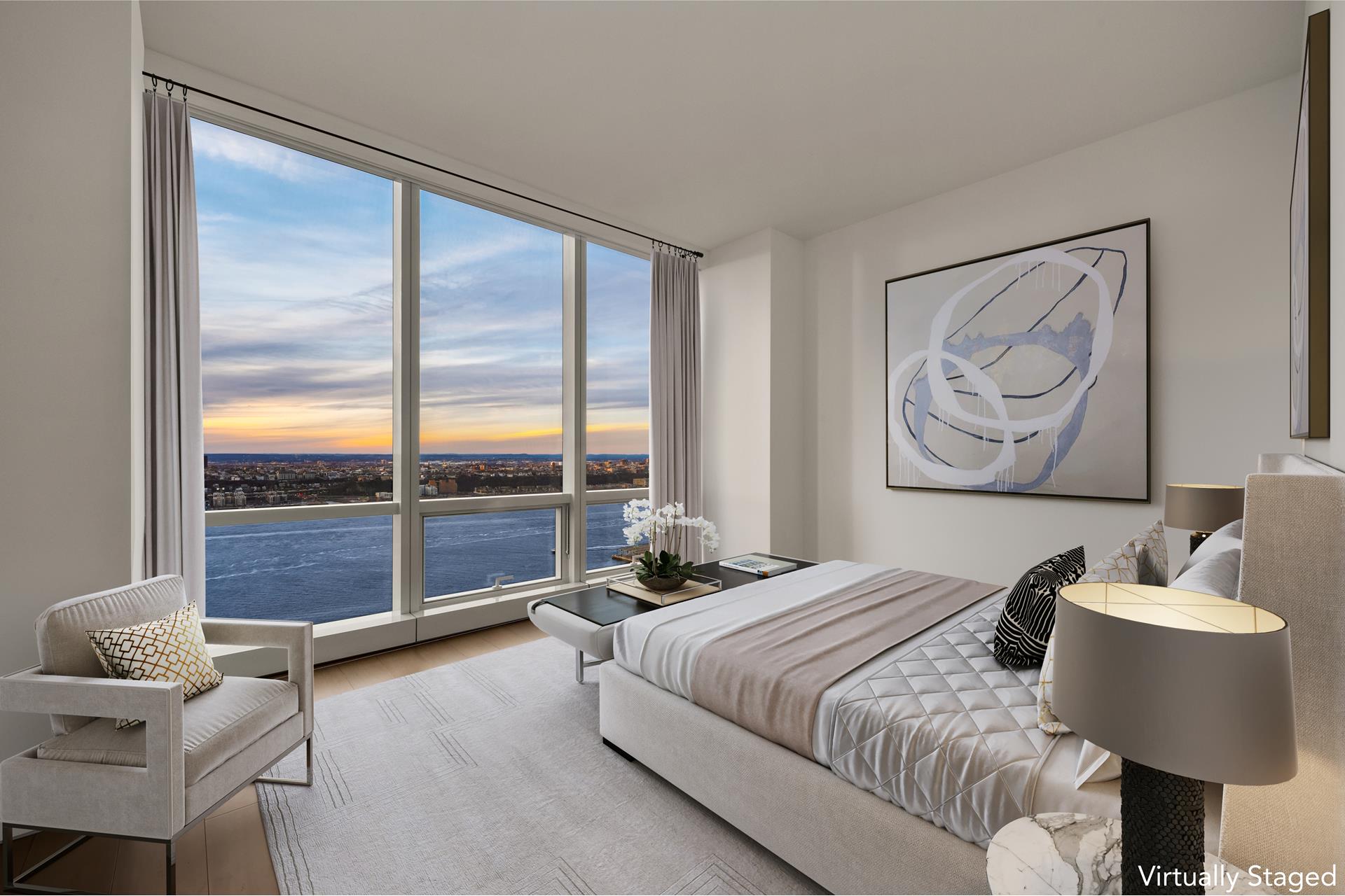 15 Hudson Yards, Unit 38C Manhattan, NY 10001 - Photo 9 of 31 a bedroom with a bed and a couch