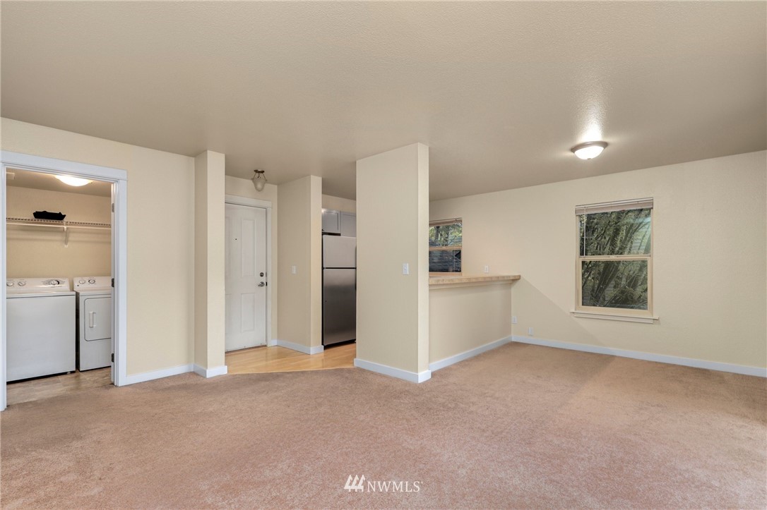 9805 Avondale Road Northeast, Unit L237 Redmond, WA 98052 - Photo 2 of 25 a view of an empty room with a window