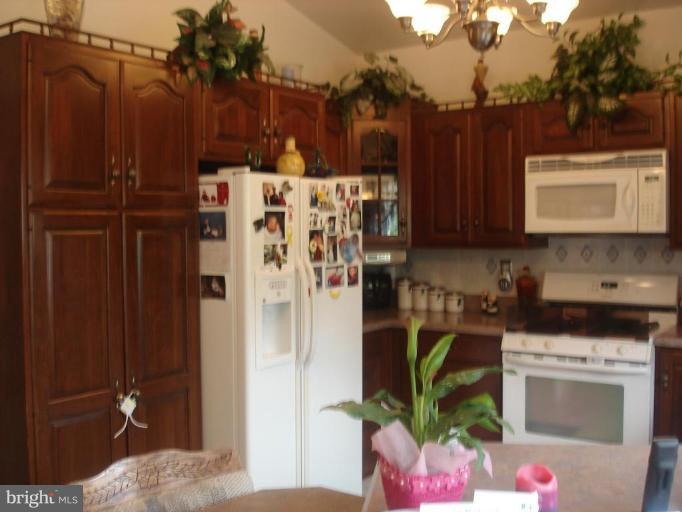 9311 Pella Place Clinton, MD 20735 - Photo 6 of 24 a view of a refrigerator in a kitchen