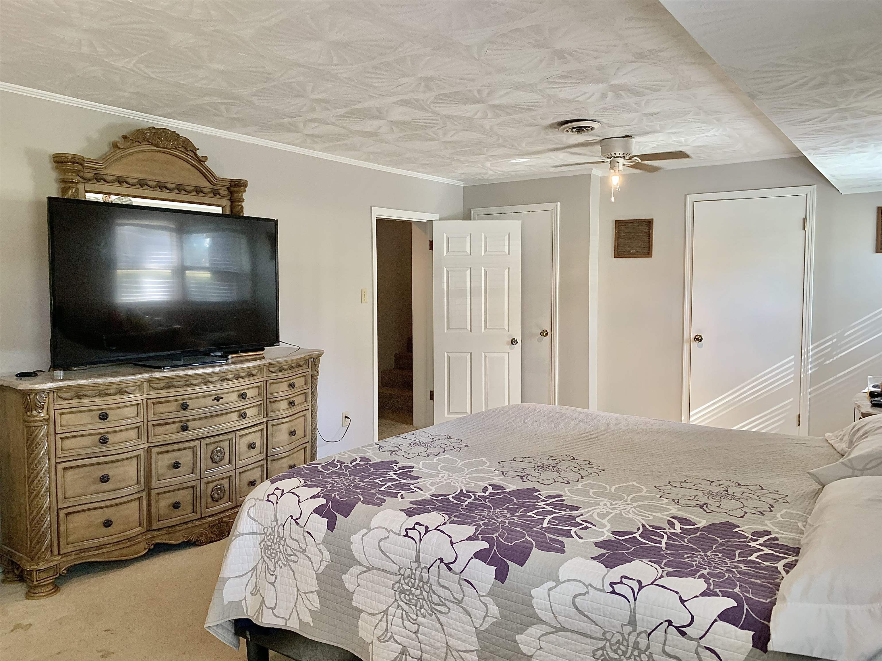 1038 Lake Street Bolivar, TN 38008 - Photo 13 of 31 Carpeted bedroom featuring ceiling fan and ornamental molding