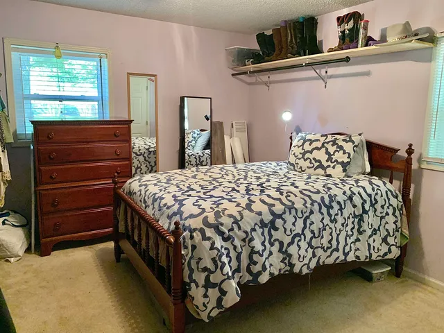 a spacious bathroom with a double vanity sink and a mirror