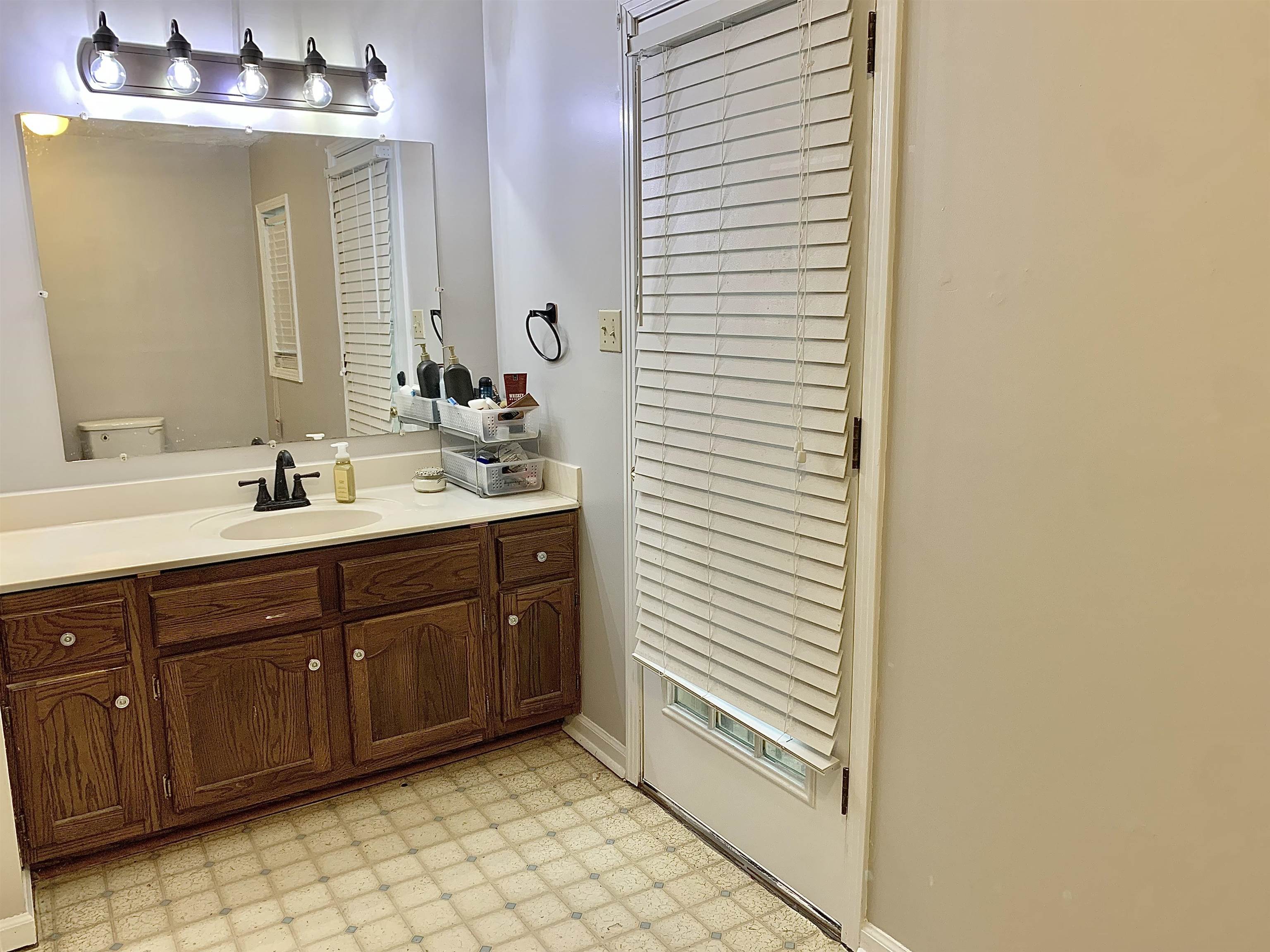 1038 Lake Street Bolivar, TN 38008 - Photo 16 of 31 Bathroom with vanity and toilet