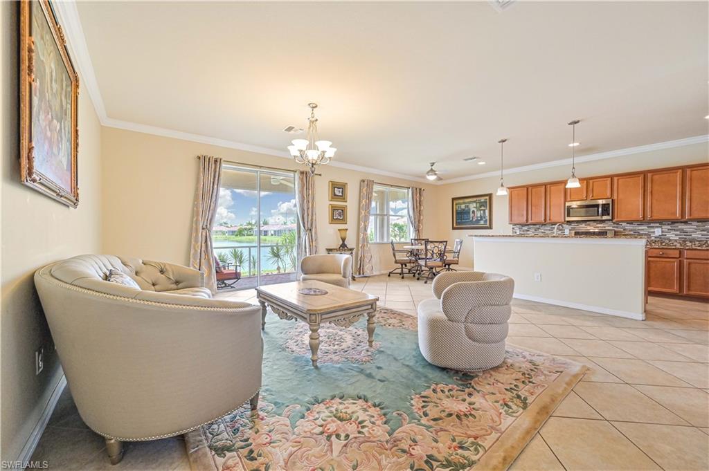 11686 Eros Road Lehigh Acres, FL 33971 - Photo 11 of 44 a living room with furniture and a large window