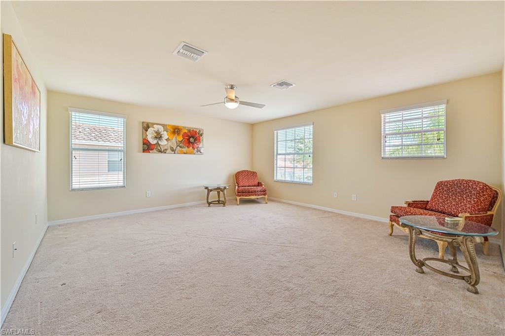 11686 Eros Road Lehigh Acres, FL 33971 - Photo 22 of 44 a livingroom with furniture and a window