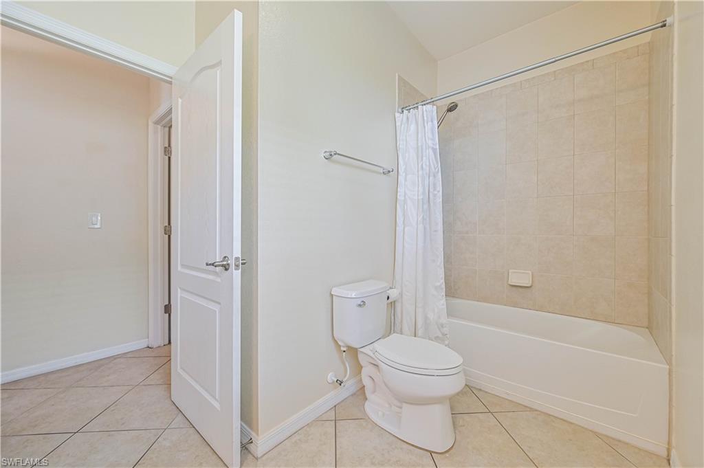 11686 Eros Road Lehigh Acres, FL 33971 - Photo 25 of 44 a bathroom with a toilet and a shower