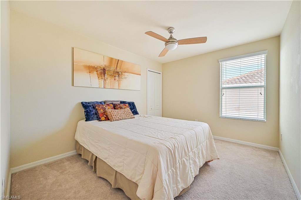 11686 Eros Road Lehigh Acres, FL 33971 - Photo 32 of 44 a bedroom with a bed and window