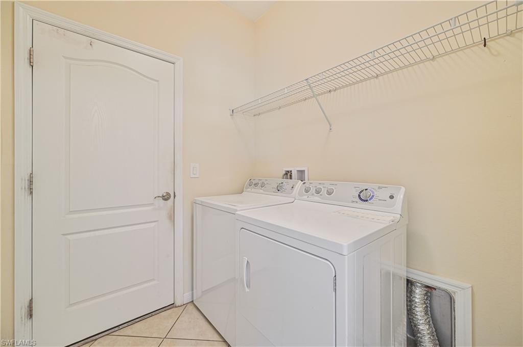 11686 Eros Road Lehigh Acres, FL 33971 - Photo 35 of 44 a utility room with dryer and washer