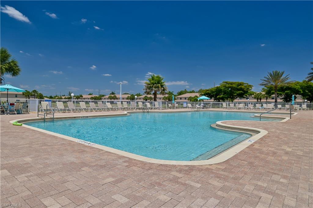 11686 Eros Road Lehigh Acres, FL 33971 - Photo 41 of 44 a view of a swimming pool with a yard