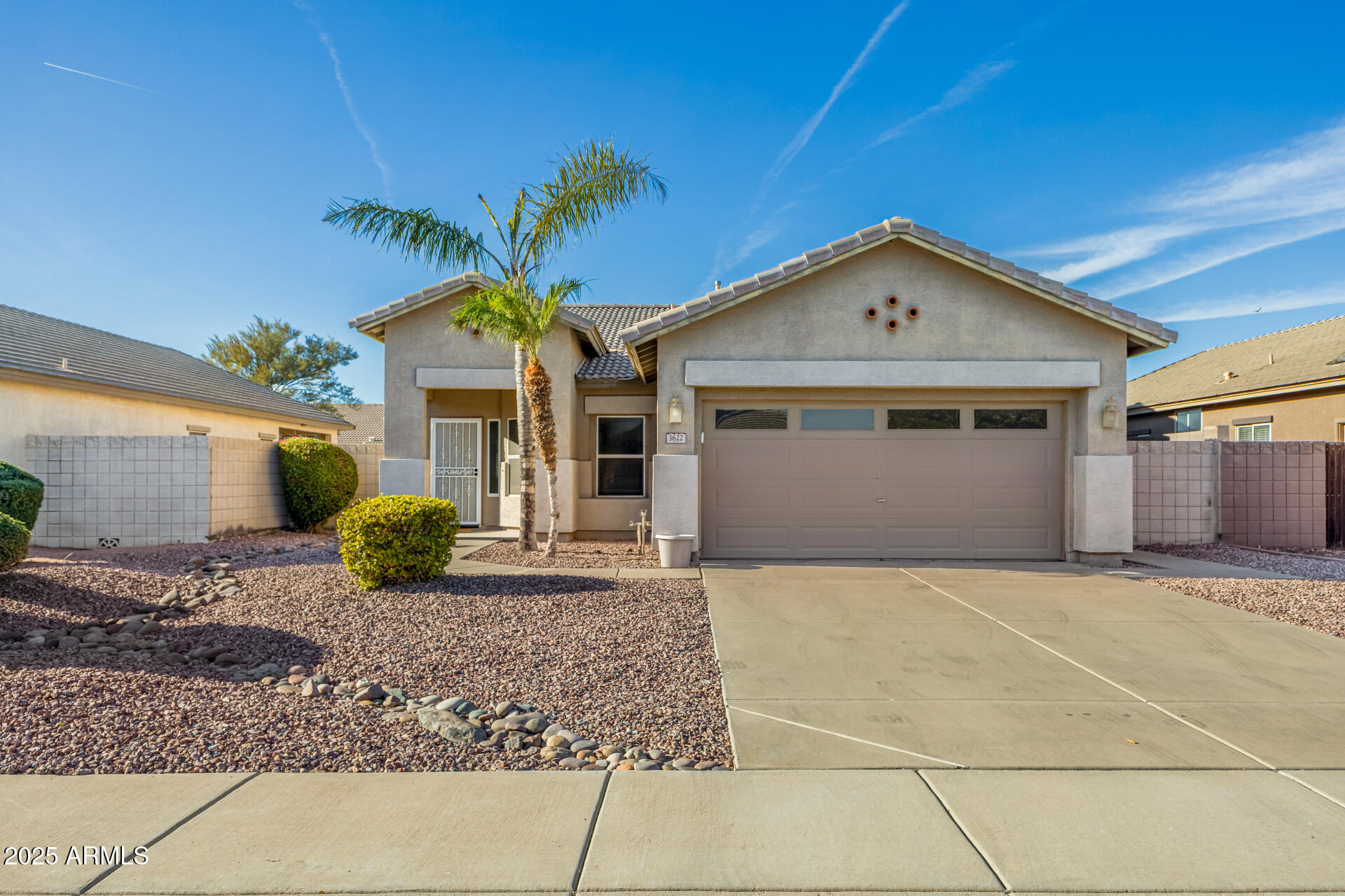 3622 South Joshua Tree Lane Gilbert, AZ 85297 - Photo 1 of 37 a front view of a house with garden