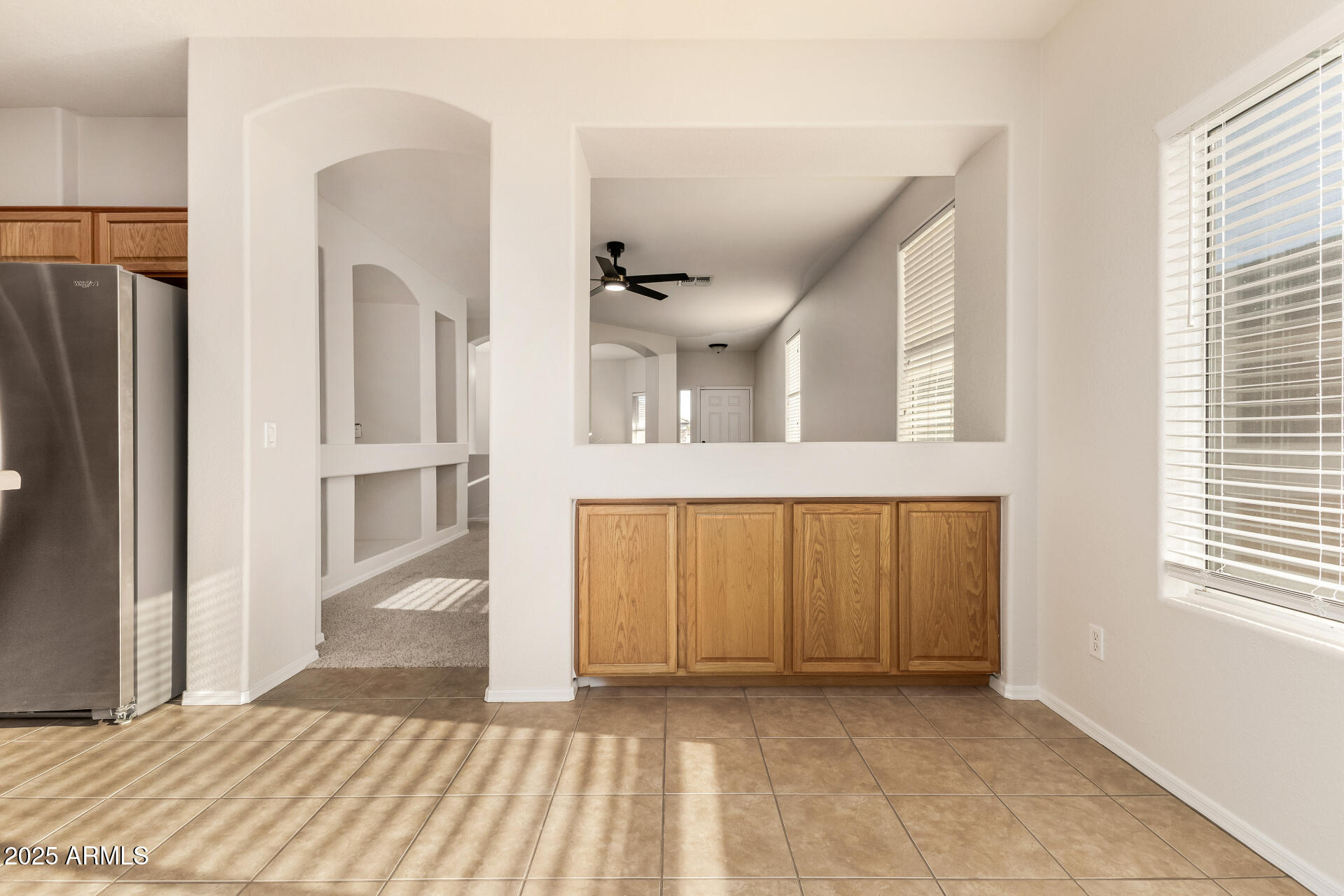 3622 South Joshua Tree Lane Gilbert, AZ 85297 - Photo 17 of 37 a view of a hallway with wooden floor and a living room