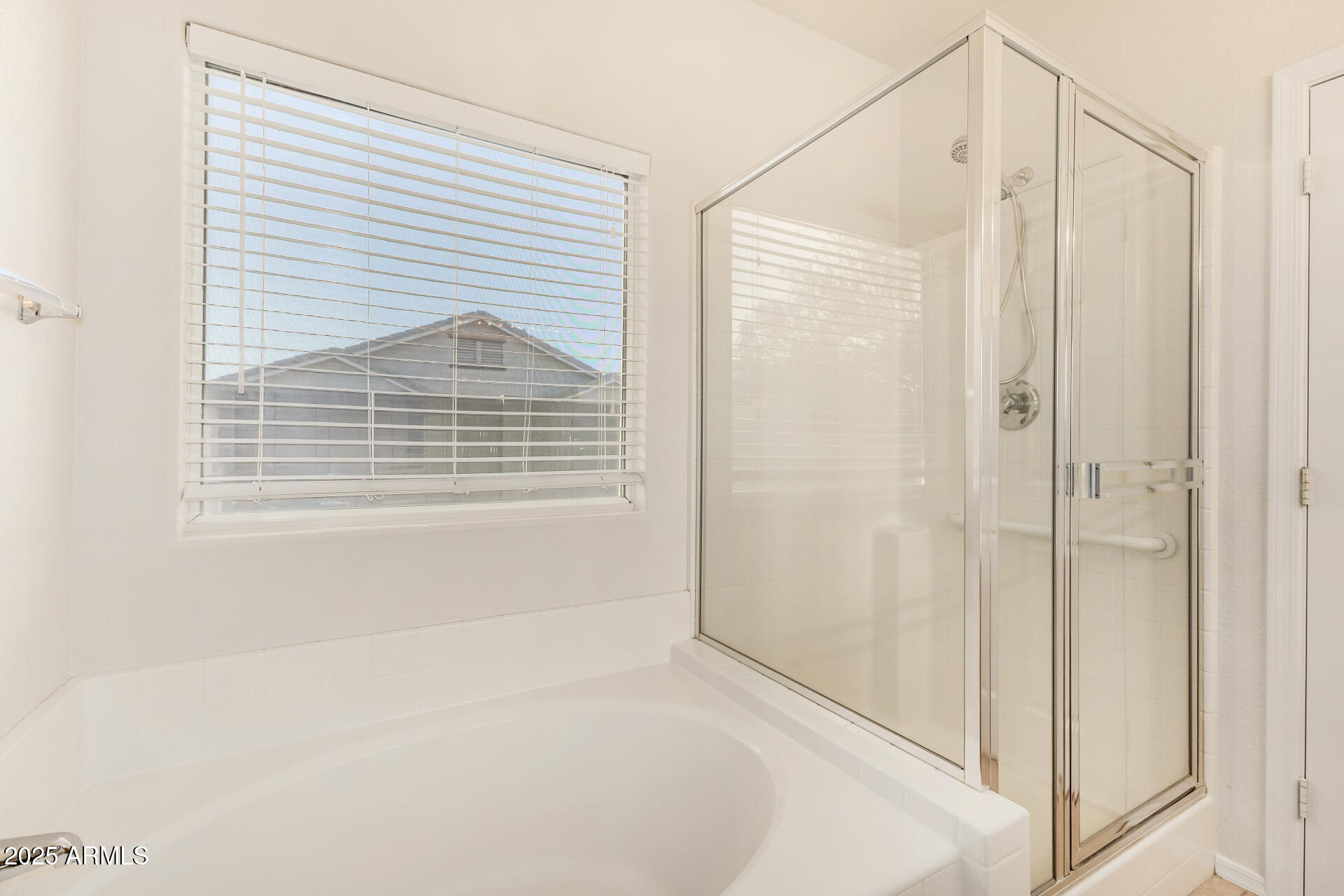 3622 South Joshua Tree Lane Gilbert, AZ 85297 - Photo 25 of 37 a bathroom with a window and a shower