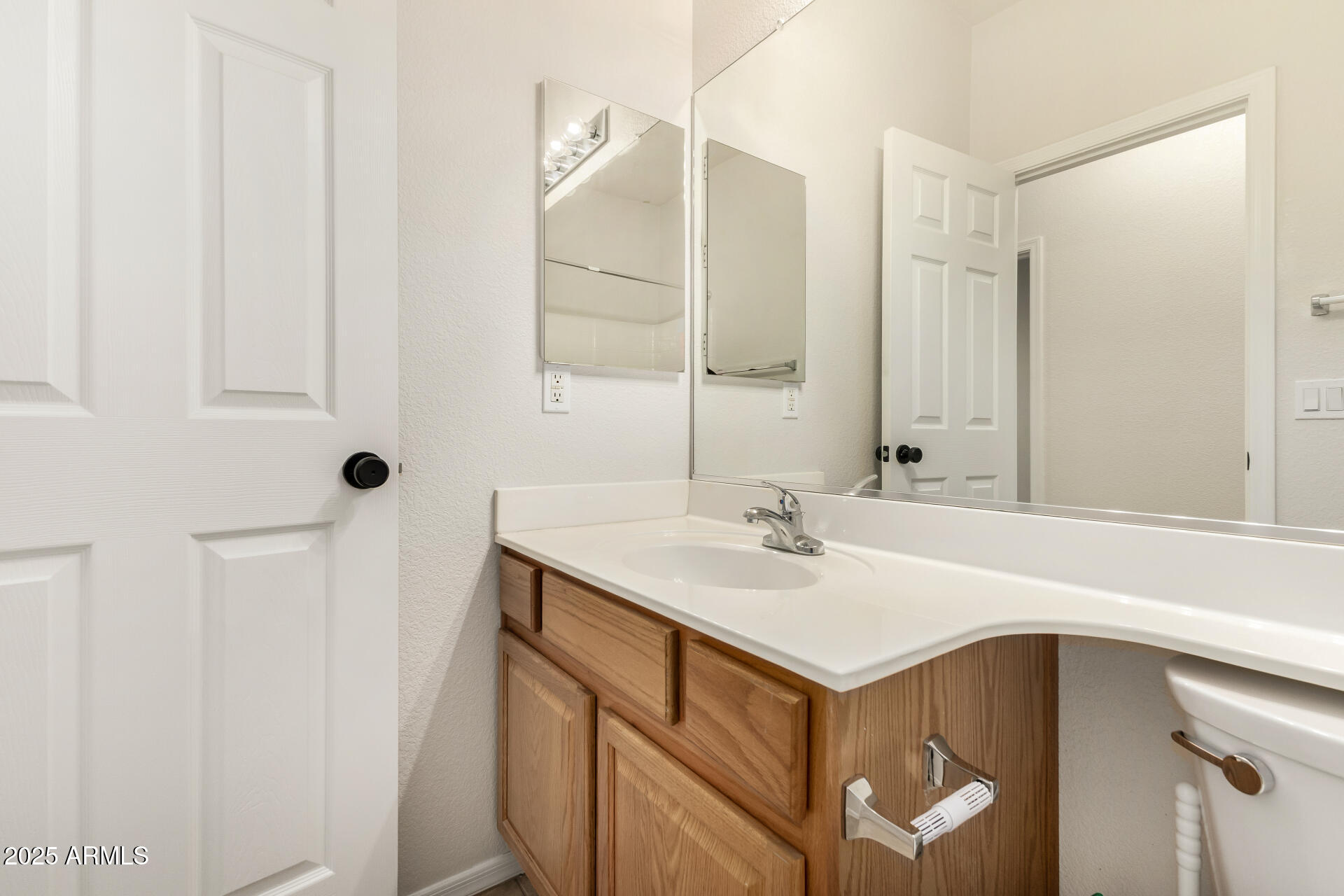 3622 South Joshua Tree Lane Gilbert, AZ 85297 - Photo 32 of 37 a bathroom with a sink and a mirror