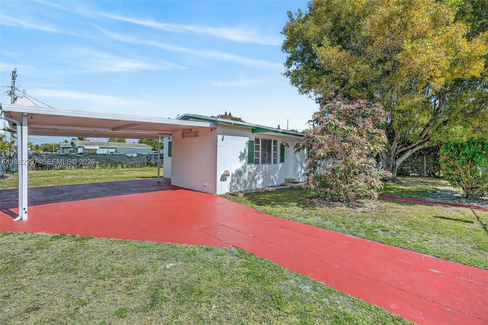 10325 Southwest 149th Terrace Miami, FL 33176 - Photo 14 of 34 a view of a backyard with a house