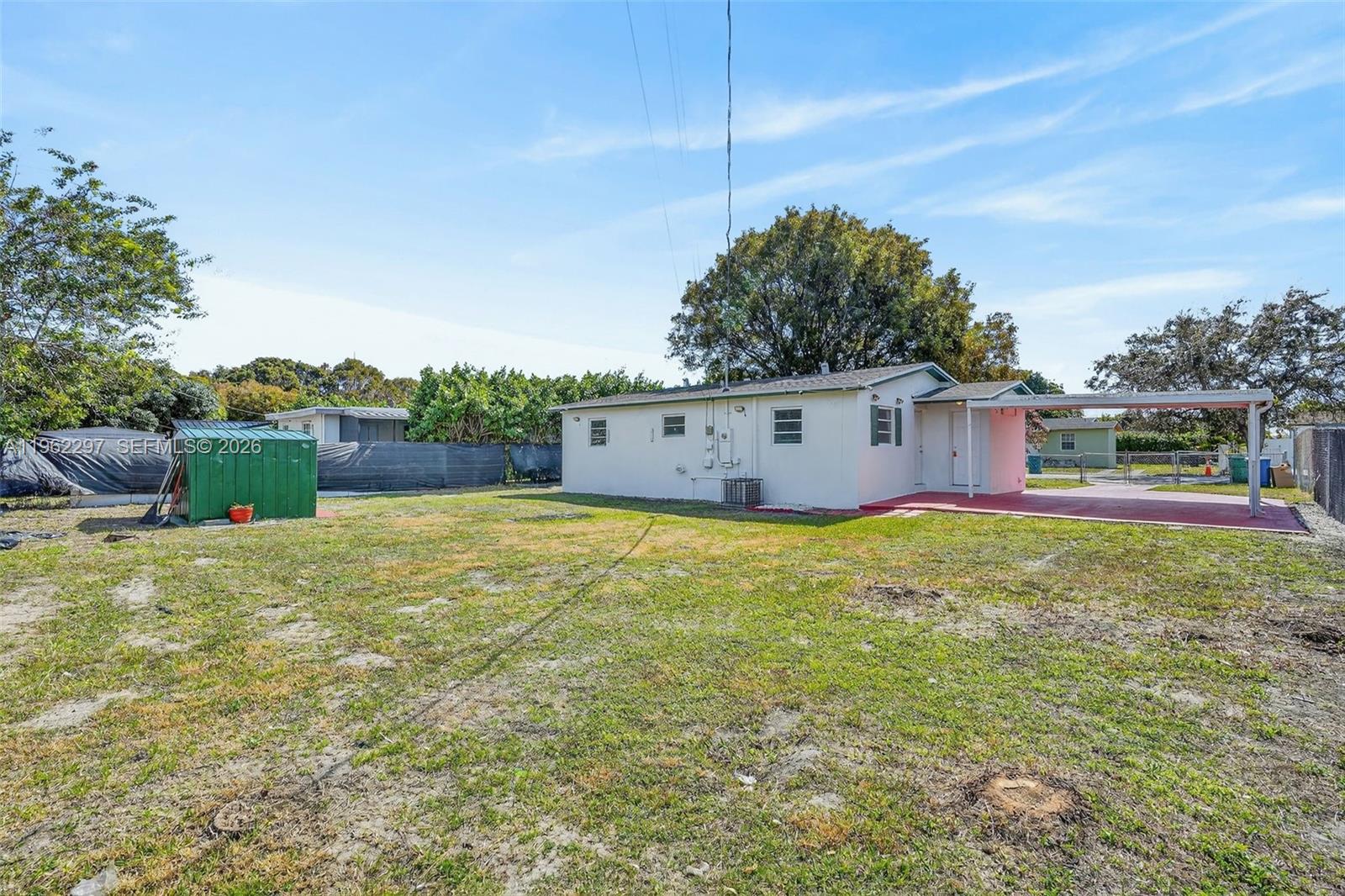 10325 Southwest 149th Terrace Miami, FL 33176 - Photo 18 of 34 a view of a house with backyard and garden