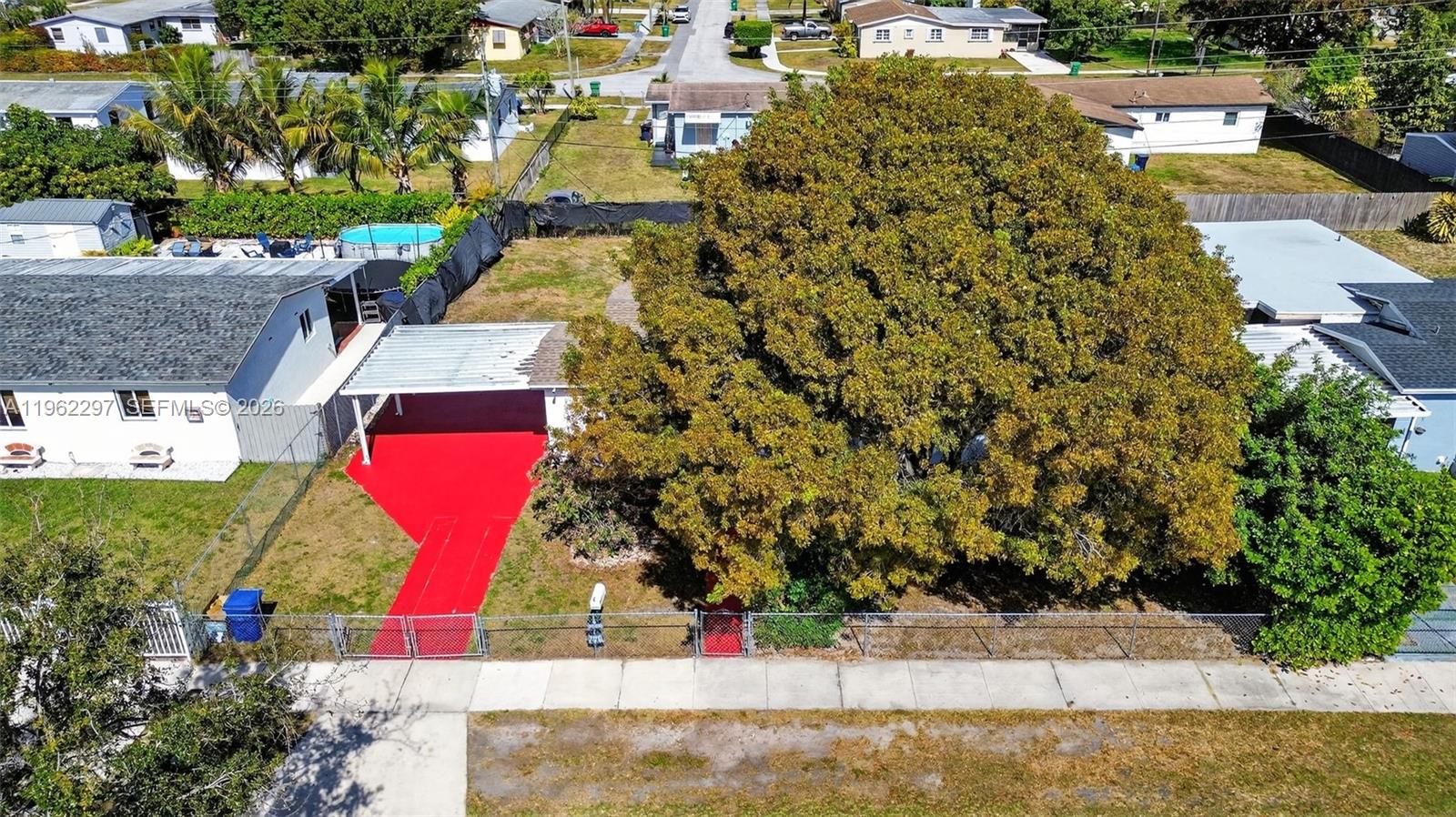 10325 Southwest 149th Terrace Miami, FL 33176 - Photo 20 of 34 an aerial view of residential houses with outdoor space